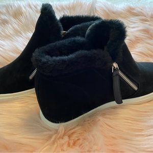 Black fur lined wedge booties.